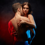 couple hugging, she hugs him, he from behind, she from in front